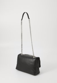 Black leather handbag with a quilted texture and silver chain strap. Features a structured rectangular shape and a top flap closure.