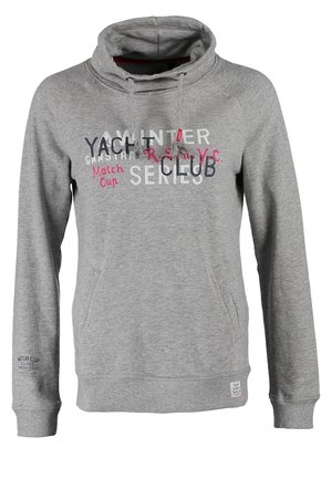 Gray hooded sweatshirt with graphic text, paired with dark blue jeans and black patterned sneakers. Black backpack with floral design.