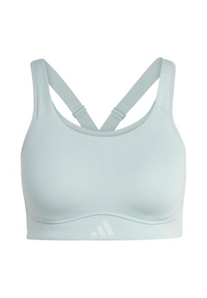 Reggiseno sportivo azzurro chiaro con design senza cuciture, spalline incrociate regolabili e dettaglio logo in basso a destra. Tessuto liscio.