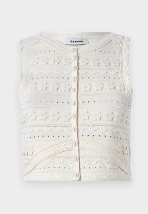 Bezramenný krémový pletený top s květinovou výšivkou, texturovanými vzory, zapínáním na perlovo knoflík a krajkovými detaily. Hladký kulatý výstřih.