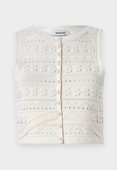 Bezramenný krémový pletený top s květinovou výšivkou, texturovanými vzory, zapínáním na perlovo knoflík a krajkovými detaily. Hladký kulatý výstřih.