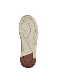 Semelle d'une sneaker, avec une base en caoutchouc beige dotée d'une texture antidérapante, accents bruns au niveau du talon et un motif en zigzag stylisé. Taille 42.