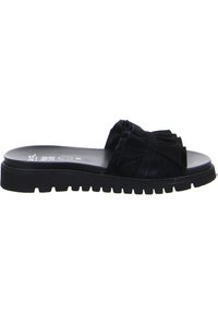 Black slide sandal featuring a textured fabric upper with gathered detailing, a flat sole, and a ridged rubber base for traction.