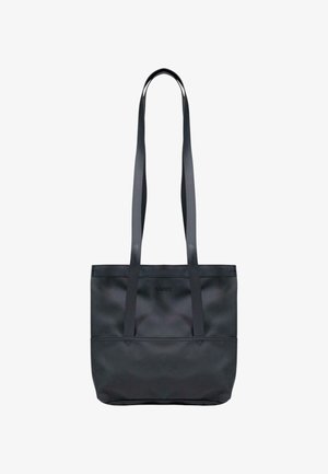 Sac cabas noir avec longues anses et logo "RAINS" discret embossé sur le devant, présenté sur fond blanc.