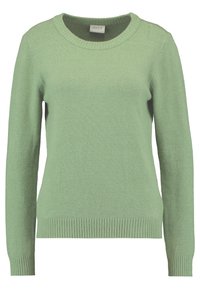 Pull vert clair à manches longues en tissu tricoté doux. Présente un col ras du cou arrondi et des poignets ainsi qu'un ourlet côtelés. Design simple et uni.