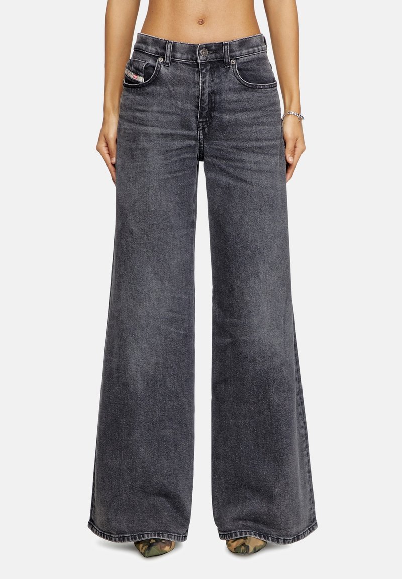 Dark gray wide-leg jeans made of denim, featuring a high waist, five-pocket design, and stitch accents along the seams.