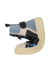 High-top sneaker featuring a blend of blue textile, beige suede, and black leather. It includes a Velcro strap and a textured rubber sole.