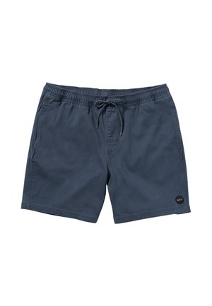 Bañadores de color azul oscuro hechos de una tela ligera, con una cintura elasticada y cordón, y un parche de logo circular en el dobladillo.