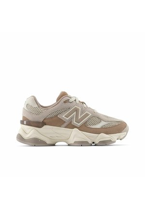 Beige and brown New Balance sneaker with mesh and suede upper, chunky sole, and branded "N" on the side, viewed from the left profile.