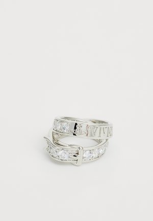 Silver rings stacked together, featuring a polished finish, one with engraved text and the other adorned with clear, round gemstones.
