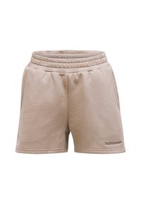 Beige Sweatshorts mit einem gerippten elastischen Bund, zwei Seitentaschen und minimaler Nahtverarbeitung. Gesticktes "PeakPerformance"-Logo auf der rechten Seite.