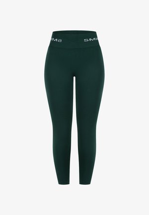 Mørkegrønne leggings med en bred linning med det hvide "SMILS"-logo. Fremstillet af glat, strækbart stof, designet til komfort og fleksibilitet.
