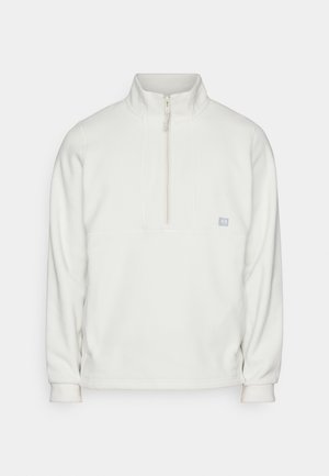 White fleece pullover with a half-zip collar. Features a rectangular chest panel and a small logo on the left side. Soft texture.