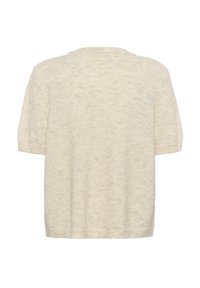 Knit, rövidujjú pulóver világos bézs színben, puha tapintással. Kerek nyakú és laza fazonú. Mintás anyag finom pöttyökkel.