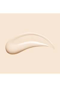 Beige Crememuster mit glatter, glänzender Textur, das eine geschwungene Form und einen subtilen Glanz vor hellem Hintergrund zeigt.