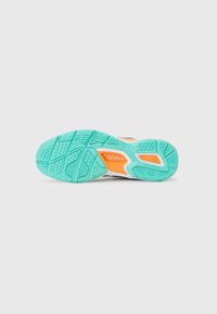 Shoe outsole featuring a textured, turquoise rubber surface with a white midsole. Accents in orange and grooves for traction. Non-marking design.