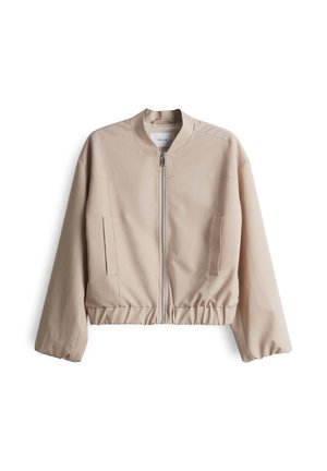 Beige bomber jacket with a high collar, zip front, elastic waistband, and side pockets. Made of smooth fabric with a streamlined design.