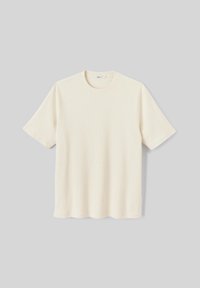 T-shirt crème à manches courtes, texture côtelée, col rond, ourlet droit, tissu léger, sans embellissements, design minimaliste.