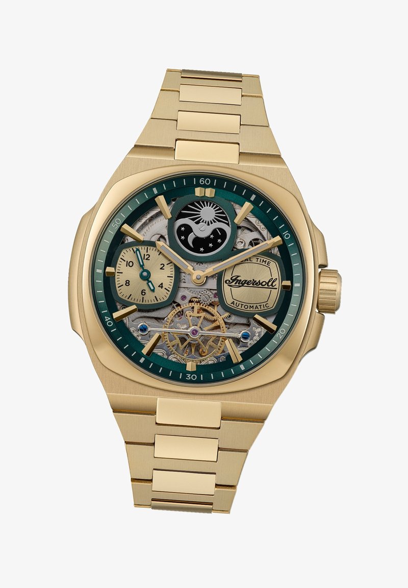 Goudkleurig automatisch horloge met een groene wijzerplaat, blootgestelde mechanische beweging en gouden accenten. Kenmerken zijn onder andere subdials en een gestructureerde band.