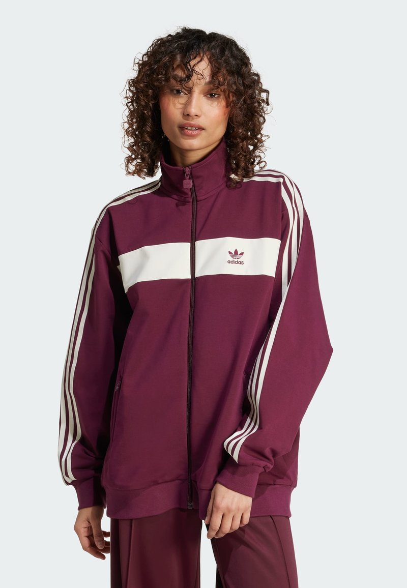 Maroon athletic jacket with white horizontal stripe and three white stripes on sleeves; full zip design and fabric texture is smooth.
