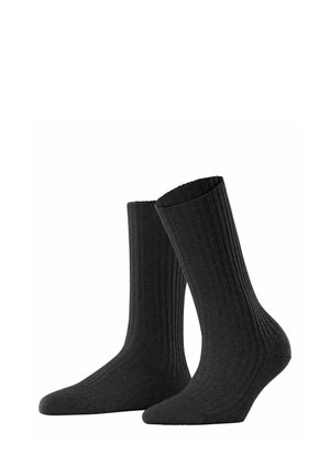 Schwarze gerippte Socken aus einem weichen Stoff, mit einer glatten Textur, hohem Design und verstärktem Zehen- sowie Fersenbereich für Langlebigkeit.