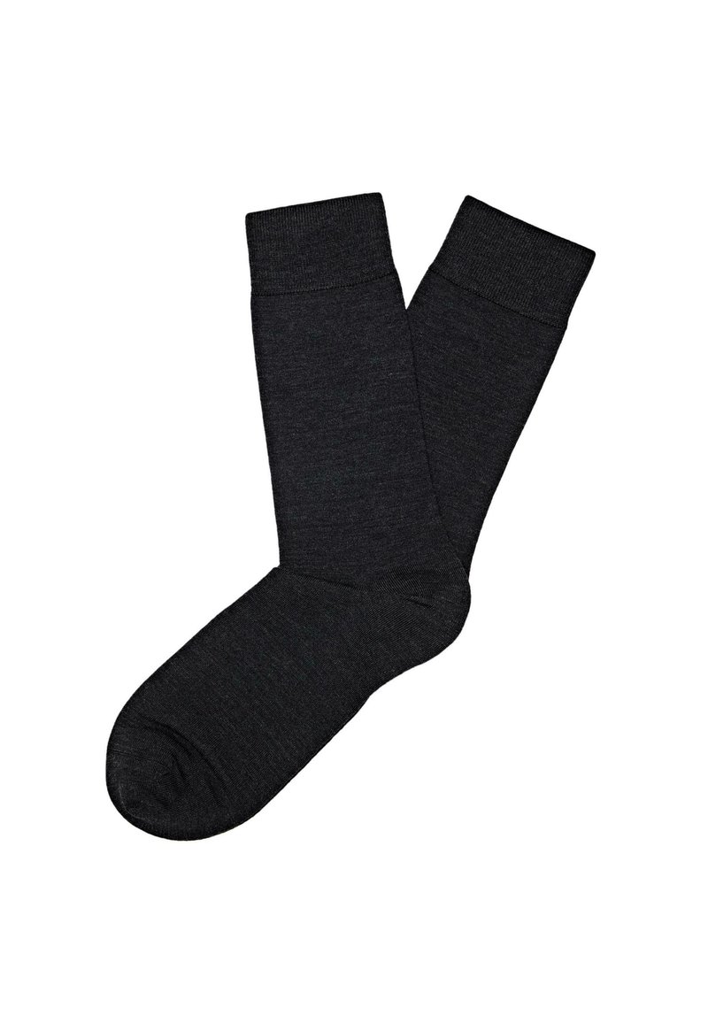 Schwarze Socken aus einem weichen Strickmaterial. Sie verfügen über eine verstärkte Ferse und Zehen, ein geripptes Bündchen-Design und eine glatte Textur insgesamt.