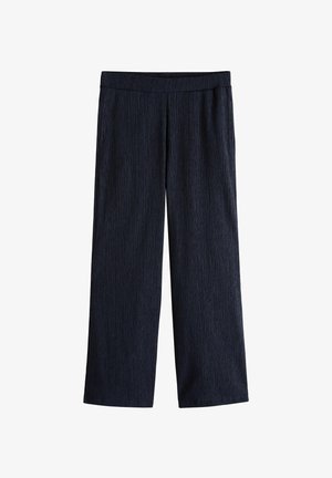 Pantalon noir texturé à jambes larges avec taille élastique, coupe droite, sans poches ni fermetures visibles.