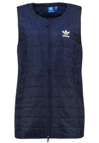 Marinblå vadderad väst med full dragkedja, quiltat mönster och vit Adidas-logga på vänster bröst. Ingen ärm och sidfickor.