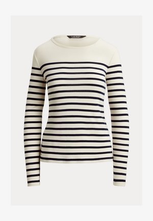 Kreminės spalvos ilgomis rankovėmis marškiniai su jūrų laivyno horizontaliomis juostelėmis. Pasirinkta apvalia iškirpte ir minkšta, tekstūruota medžiaga. Paprastas, prigludęs dizainas.