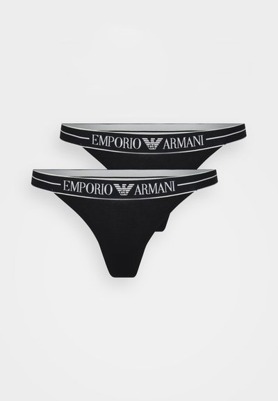Svart truse i tanga-stil med bred elastisk linning med "EMPORIO ARMANI" logo og en myk, glatt tekstur.