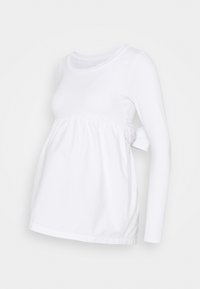 Vit långärmad gravidtopp i mjuk bomull, med rynkad byst, rund halsringning och knytaccent på sidan för en avslappnad passform.