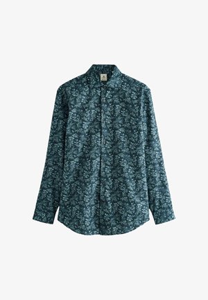 Chemise à manches longues boutonnée vert foncé avec un motif floral bleu clair et un col classique, posée à plat sur un fond blanc.