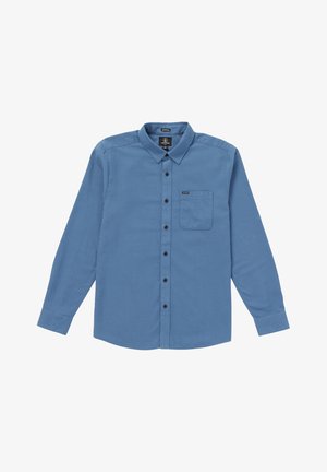 Camicia azzurra a maniche lunghe con bottoni, realizzata in tessuto morbido, dotata di taschino sul petto, bottoni neri e orlo dritto. Etichetta del marchio sul colletto.