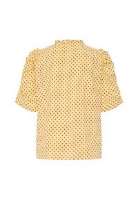Blouse jaune à manches courtes avec des pois marron et des épaules volantées, vue de dos sur fond blanc.