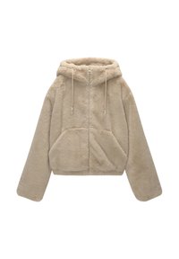 Giacca con cappuccio in pelliccia sintetica beige con chiusura frontale con zip, taglio oversize, spalle scese e due tasche frontali. Texture morbida con dettagli a coulisse.