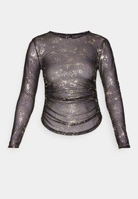 Langärmliges Oberteil aus durchsichtigem schwarzem Stoff mit goldenen Glitzerakzenten, mit rundem Ausschnitt und gerafftem Stoff um die Taille.