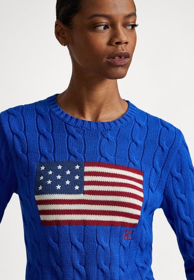 Kék kötött pulóver amerikai zászló mintával, piros és fehér csíkokkal és fehér csillagokkal, piros "RL" felirattal.