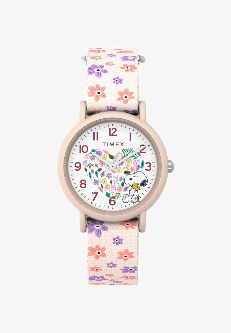 Timex óra, kerek, világos rózsaszín tok, fehér számlappal, melyen virágminták és Snoopy látható, valamint egy szövetpánt rózsaszín és lila virágokkal.