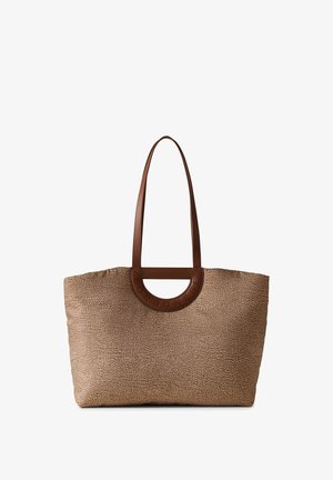 Brown textured tote bag with two brown shoulder straps and a circular logo accent. Features a pebbled surface and open top design.