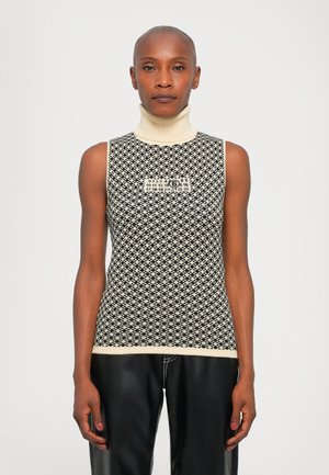 Top sans manches en crème et noir avec un motif en diamant texturé et une étiquette logo au centre de la poitrine.