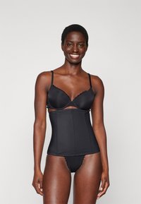 Black lingerie set featuring a lightly padded bra with lace trim and a high-waisted shaping brief, both made of smooth fabric.