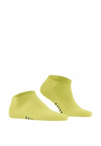 Skarpetki do kostki w jaskrawym żółtym kolorze. Wykonane z materiału o gładkiej fakturze. Posiadają ściągacz i logo "FALKE" w granacie na boku.