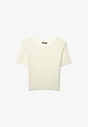 Pull en maille blanc à manches courtes avec un motif en diamant subtil et un col, des poignets et un ourlet côtelés, posé à plat sur un fond blanc.