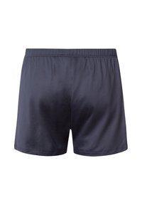 Námořnické modré trenýrky vyrobené z hladké tkaniny, s elastickým pasem a jednoduchým, nezdobeným designem.