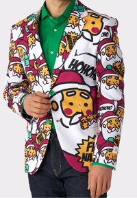 White blazer featuring colorful holiday-themed graphics, including pizza and Santa icons, with green buttons and a green shirt underneath.