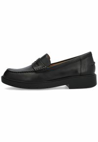 Mocasín de cuero negro con un acento bordado en la parte delantera y un tacón elevado. Textura suave y diseño de punta redondeada. Suela de goma.
