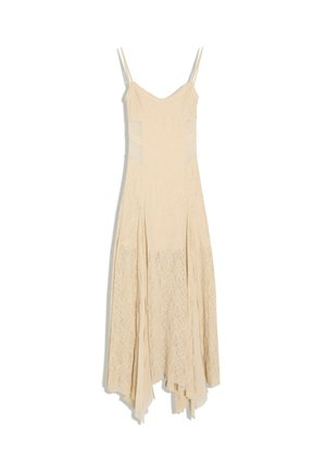 Langes beiges Spitzenkleid mit dünnen Trägern und ausgeschnittenen Seiten, mit asymmetrischem Saum.
