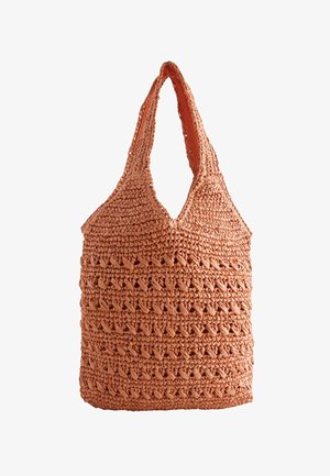 Weiche orange gewebte Tragetasche mit breiten Griffen und offenem oberen Design, mit strukturiertem, geflochtenem Häkelmuster.