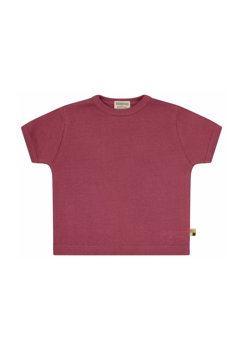 T-shirt a maniche corte color ruggine realizzato in morbido cotone. Collo a giro, vestibilità rilassata, con una piccola etichetta logo sul lato.