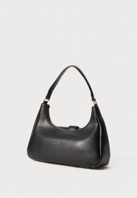 Black leather shoulder bag with a single handle and gold zipper detail on a plain light background.